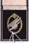 A Third Reich Army Parachutists breast badge, silvered eagle with gilt wreath, marked on reverse “