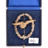 A Third Reich Glider Pilot’s badge, gilt eagle, white metal wreath. In case of issue. VGC (case