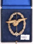 A Third Reich Glider Pilot’s badge, gilt eagle, white metal wreath. In case of issue. VGC (case
