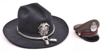An American 1970s Stratton wide brimmed hard black felt police hat, with silvered cords and “acorns”