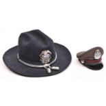 An American 1970s Stratton wide brimmed hard black felt police hat, with silvered cords and “acorns”