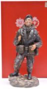 An Ashmor hand painted Fine Bone China figure representing a Falklands War soldier of the 2nd Bn The