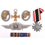 A Third Reich Luftwaffe NCO’s cap cockade (one pin missing); grey metal War Merit Cross 2nd class