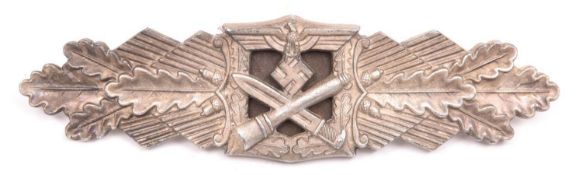 A Third Reich Close Combat clasp, silvered 30 Day finish, marked on reverse “FEC. W.E. PEEKHAUS