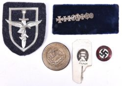 A Third Reich NSDAP badge; a circular RAD lapel badge, 3 other items. GC (5) £40-50