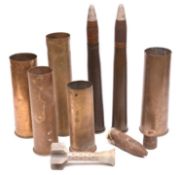A quantity of WWII shell cases comprising: 2 Drill rounds with brass cases and drill heads; a 1941