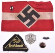 A Third Reich Hitler Youth armband and enamel badge; an embroidered “Sud Hochland” triangular badge;