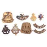 Sussex badges: pair T/RFA/SUSSEX brass titles, with backing plates; Y/SUSSEX brass title; pair ROYAL