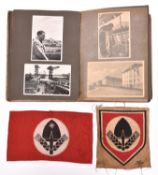 A Third Reich photograph album, the front mounted with an RAD metal cap badge, containing 87