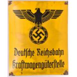 A black on yellow enamelled sign, bearing Third Reich eagle above “Deutsche Reichbahn Kraft-