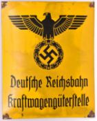 A black on yellow enamelled sign, bearing Third Reich eagle above “Deutsche Reichbahn Kraft-