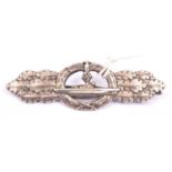 A Third Reich U Boat breast badge, silvered finish, marked on reverse”ENTWURF PEEKHAUS AUSF SCHWERIN