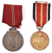 A Third Reich Eastern Front medal, also a Spanish “Blue Division” Russian volunteer medal, both with