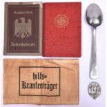 A Third Reich DAF Mitgliedsbuch to Annelese Kaishel; a metal serving spoon stamped with DAF
