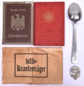 A Third Reich DAF Mitgliedsbuch to Annelese Kaishel; a metal serving spoon stamped with DAF