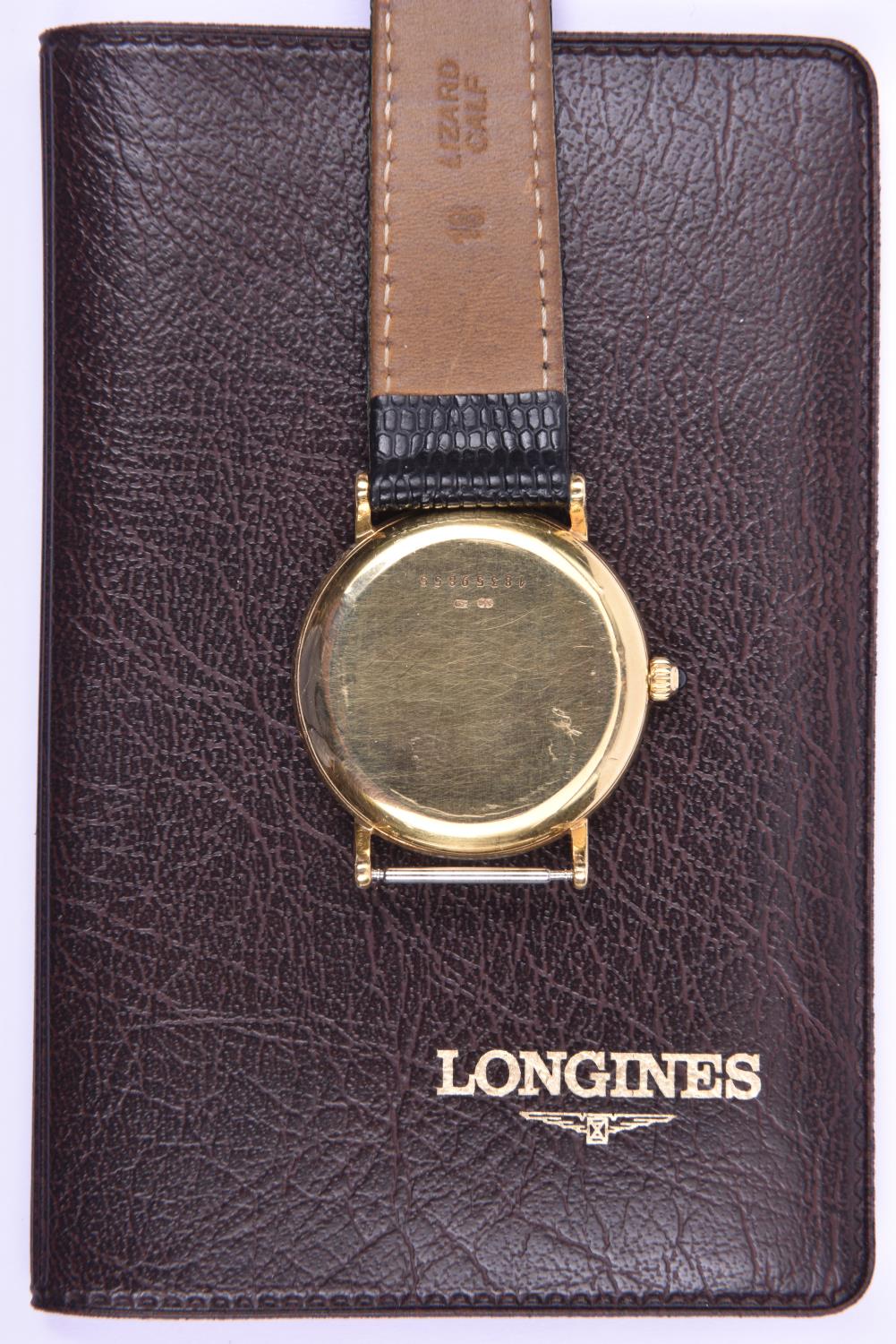 A Longines Quartz watch with quartz movement 18ct gold case and face, black leather strap and date - Image 2 of 2