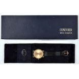 A Concord Nine Quartz watch with quartz movement 18ct gold case and face and black leather strap.