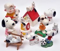 10 Ceramic Snoopy figures. Charlie Brown with Snoopy. Snoopy lying on kennel. Snoopy & Woodstock