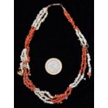 A mid-Victorian red and white 3-strand coral necklace made up of small pieces. GC, requires