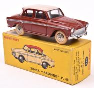 A French Dinky Simca Aronde P.60 (544). In brick red, with silver side-flash and cream roof,