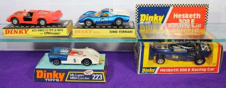 4 Dinky Toys. A Dino Ferrari (216) in metallic blue with white engine cover and spoked wheels.