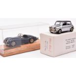 2 white metal 1:43 models. A Mini Classics Collection Rover Mini Cooper Mk4. An example in