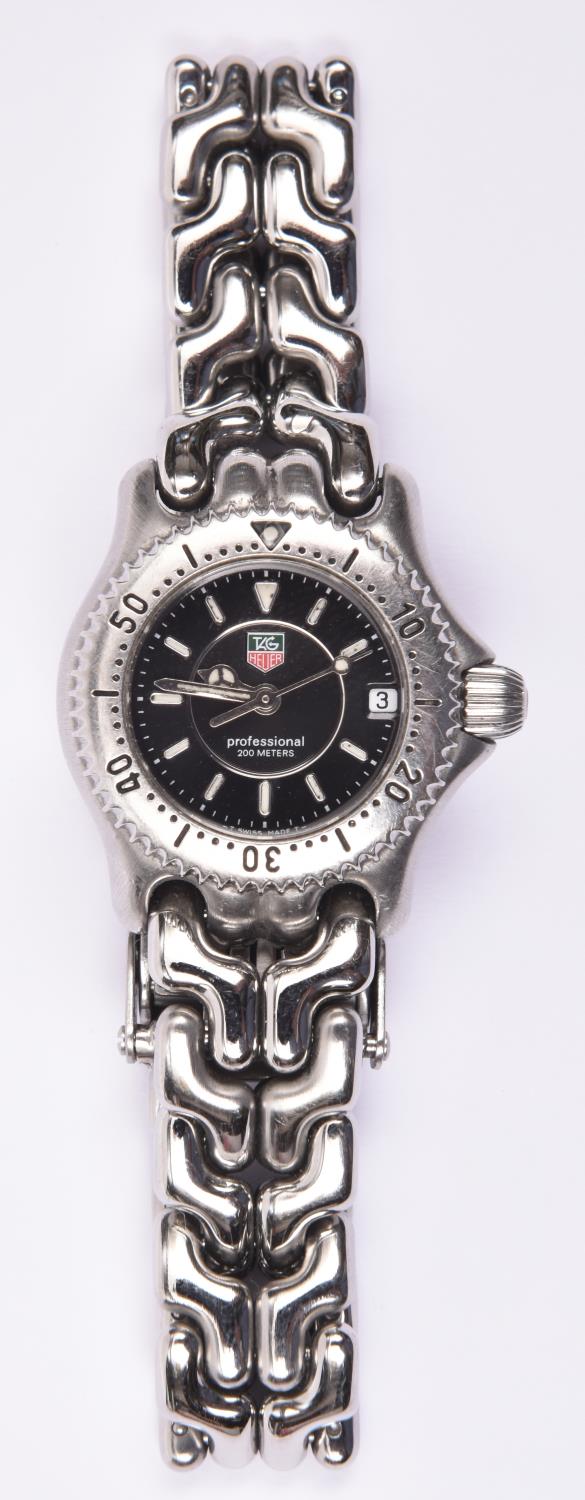 A TAG Heuer Professional watch with quartz movement, stainless steel case and bracelet and black