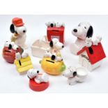 10 Ceramic Peanuts Snoopy Figures. Various types including - Snoopy and Woodstock laying on a lemon,