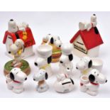 11 Ceramic Peanuts Snoopy figures. Snoopy & Woodstock lying on kennel. Snoopy lying on kennel.