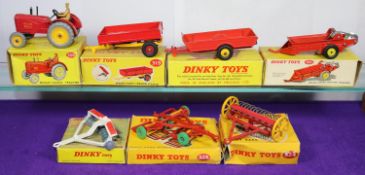 7 Dinky Toys Farm Related Items. A Massey-Harris Tractor (300) in red with metal wheels with