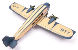 A 1930's Mettoy tinplate clockwork 2 engine Airliner. Finished in cream and blue, with fixed key,
