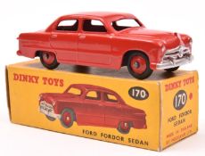 Dinky Toys Ford Fordor Sedan (170). An example in red with red wheels and black tyres. Boxed,