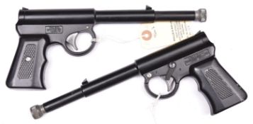 A pair of Harrington “Gat” pop out air pistols, of black lacquered alloy construction with plastic