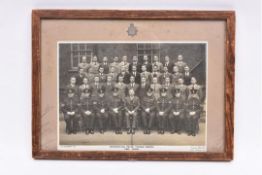 A framed group photograph of the graduating class at the “Metropolitan Police Training School,