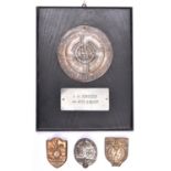 46 A Third Reich thin pressed metal circular plaque, diam 80mm, embossed with SS runes and