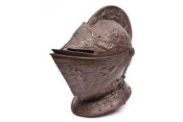 A good old cast iron copy of a late 16th century close helmet, with two piece hinged vizor, finely