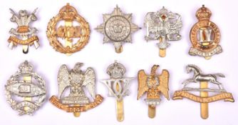 10 Mostly WWII period Cavalry cap badges: WM KDG, Bays, 3rd Carabiniers, 4/7th DG, Royal Dragoons (