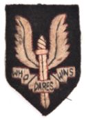 A WWII SAS OR’s embroidered beret badge, GC £40-50.