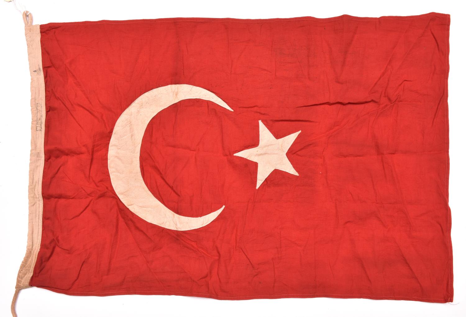 A WWI Turkish military flag, 95cm x 57cm, red with white applique star and crescent. GC £90-100.