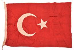 A WWI Turkish military flag, 95cm x 57cm, red with white applique star and crescent. GC £90-100.