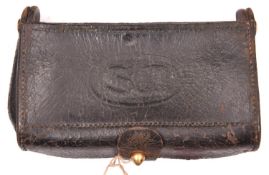 An American M1874 McKeever pattern leather cartridge pouch, the hinged lid impressed “US” in oval