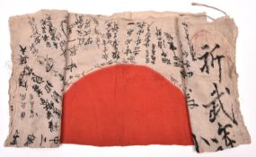 A scarce original WWII Japanese battle flag, 39” x 27”, having central red disc surrounded by