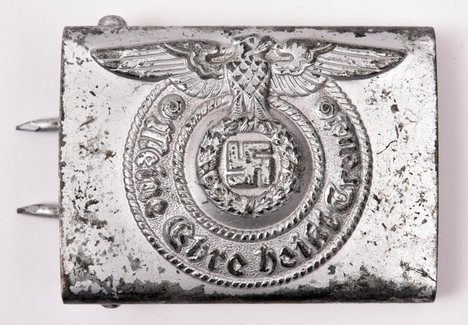 A Third Reich Waffen SS man’s belt buckle, of silvered finished steel. GC (worn) £100-120.