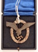 A Third Reich Pilot’s badge, bronze coloured eagle with silvered wreath, in its fitted case. GC £