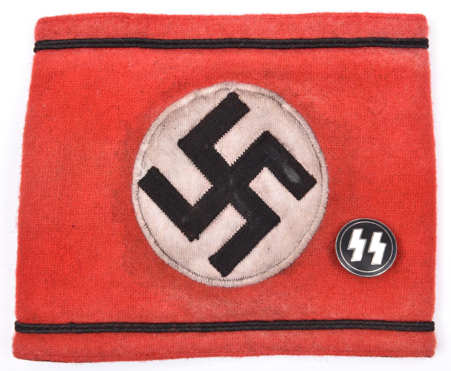A Third Reich SS Allgemeine arm band, embroidered piping and swastika panel, metal securing