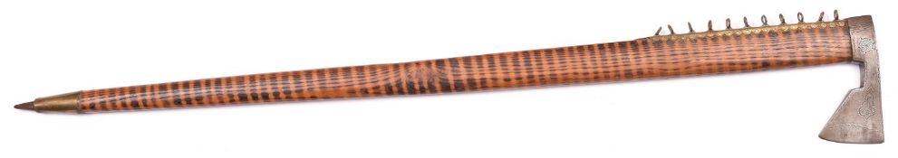 A decorative Polish shepherd’s axe/walking stick, 33½” overall, the small iron head having punched