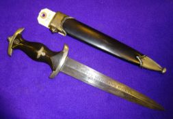 A Third Reich SS man’s dagger, blade 22cm, RZM etc marked, black hilt with SS insignia and plated