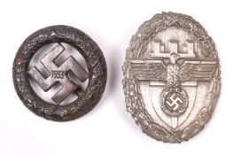 A Third Reich NSDAP Ost Preussen breast badge, also a 1933 Munich Putsch badge in bronze. GC (2) £