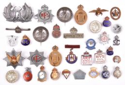 31 various WWI and WWII period lapel and pin back badges, including WWI “Services Rendered” (2), “On