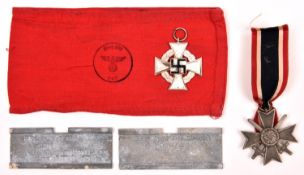 A Third Reich War Service cross with swords; a Stufe Cross 2nd grade silvered; a red armband with